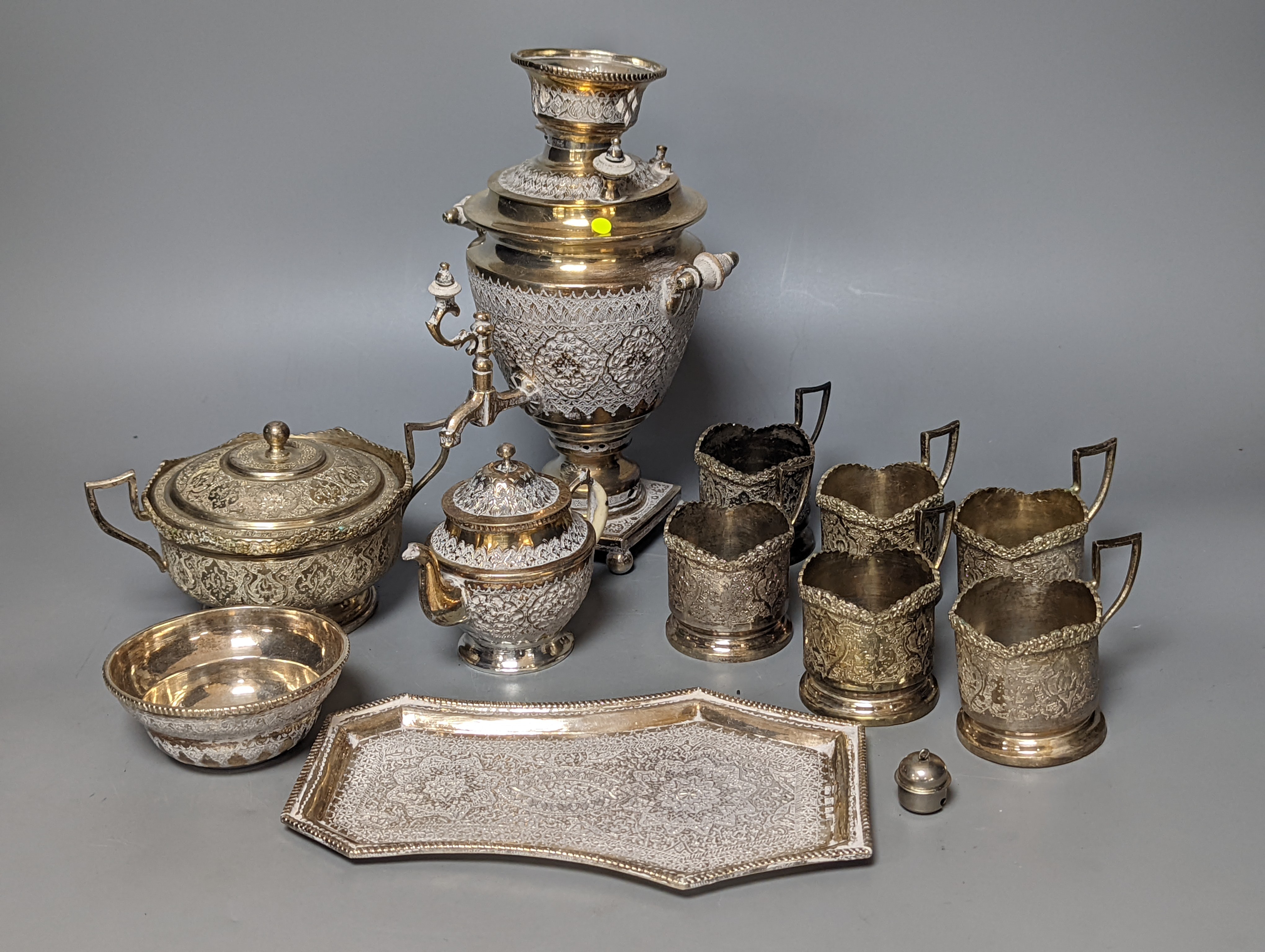 A set of six Persian embossed 84 standard white metal coffee cup holders and matching sugar bowl and cover by Vartan and four other Persian white metal items.